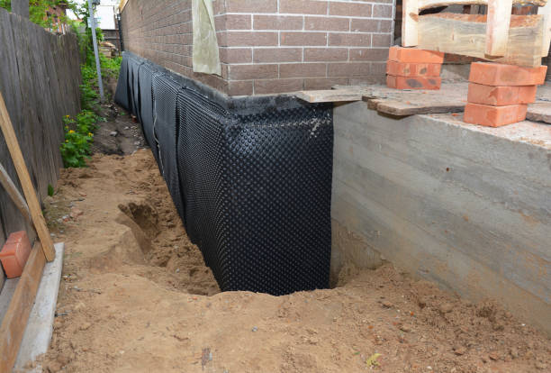 Happy homeowners after waterproofing job in Grelton